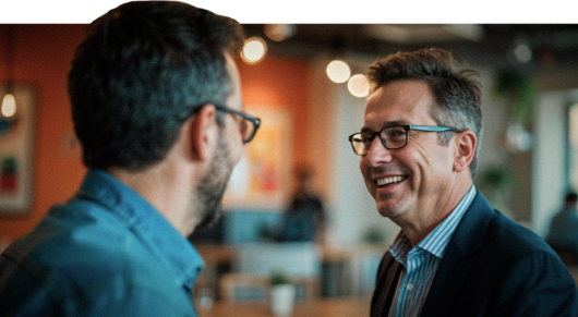 Two consulting firm owners preparing their strategy for a client meeting.